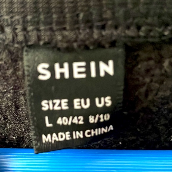 This is a black crewneck sweatshirt from shein size large US. - Picture 4 of 4